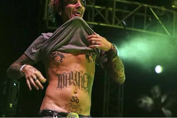 Tommy Leed has 'Om' tattooed